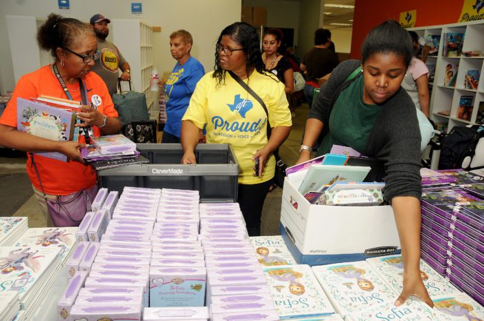 Teachers choose books at a Houston book drop post-Hurricane Harvey