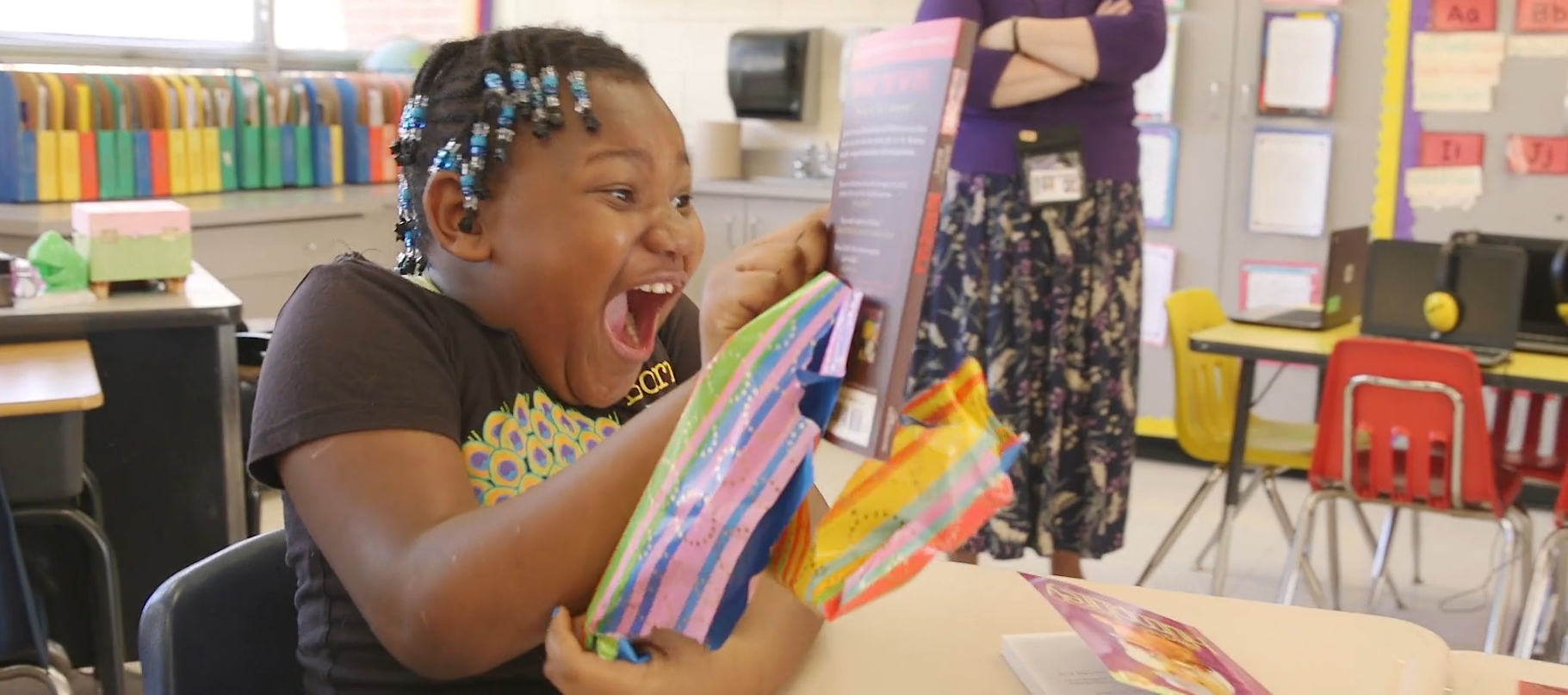 Student Unwrapping Book