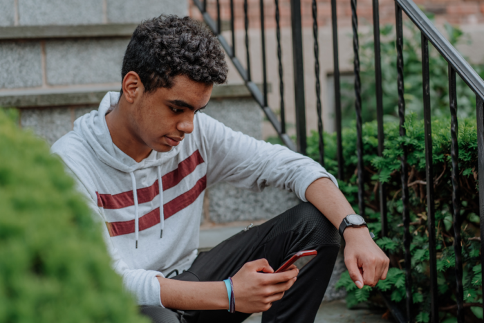 young black teenager on front porch