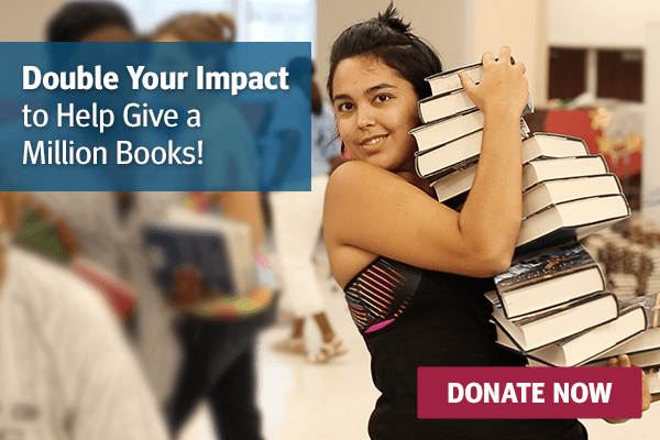 image of a girl holding a stack of books. There is a blue box in the top, left corner with text that reads, 'Double your impact to help give a million books!' There is also a red box in the bottom, right corner with text that reads, 'Donate now'.