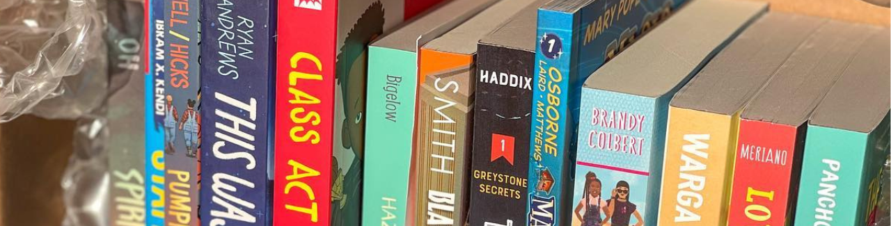 close up image of book spines in a box.